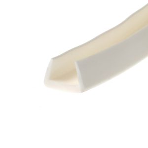 Close-up of a white curved object with beige shading along a diagonal edge against a white background.