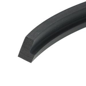 Close-up of a dark rubber tire edge with a slightly textured surface, curved across the frame