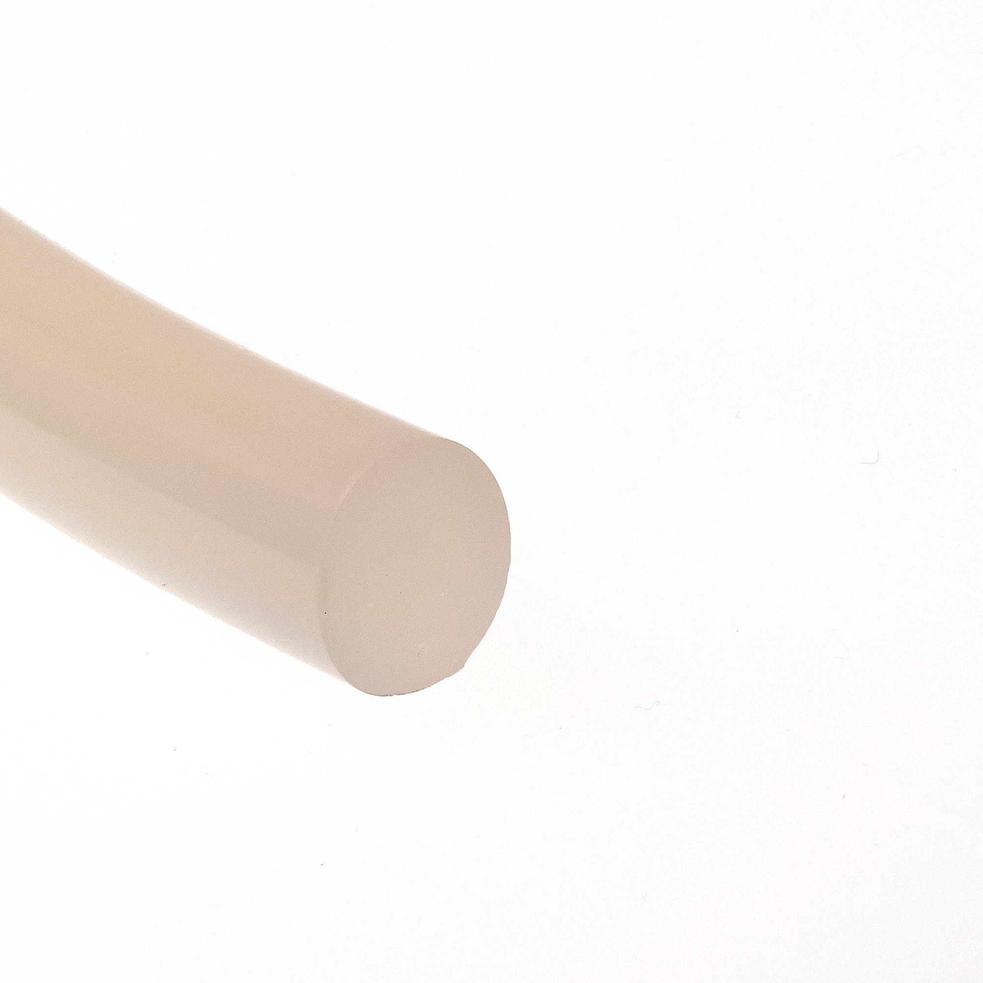 sznur-silikonowy-lity-fi-20mm-bezbarwny-023899-1 - Centrum uszczelek Close-up of beige adhesive bandage strips overlapping on a white background.
