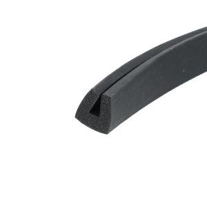 Close-up of black foam weatherstripping with a hollow U-shaped cross-section for sealing gaps.