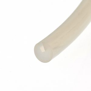 Close-up of a pale beige cylindrical object with a rounded end diagonally across a white background.