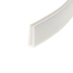 Close-up of a white decorative door frame corner with beveled molding and soft shadows along the angleed edge.