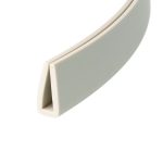Close-up of a light gray plastic object with a rounded white edge and soft curves, viewed at an angle.