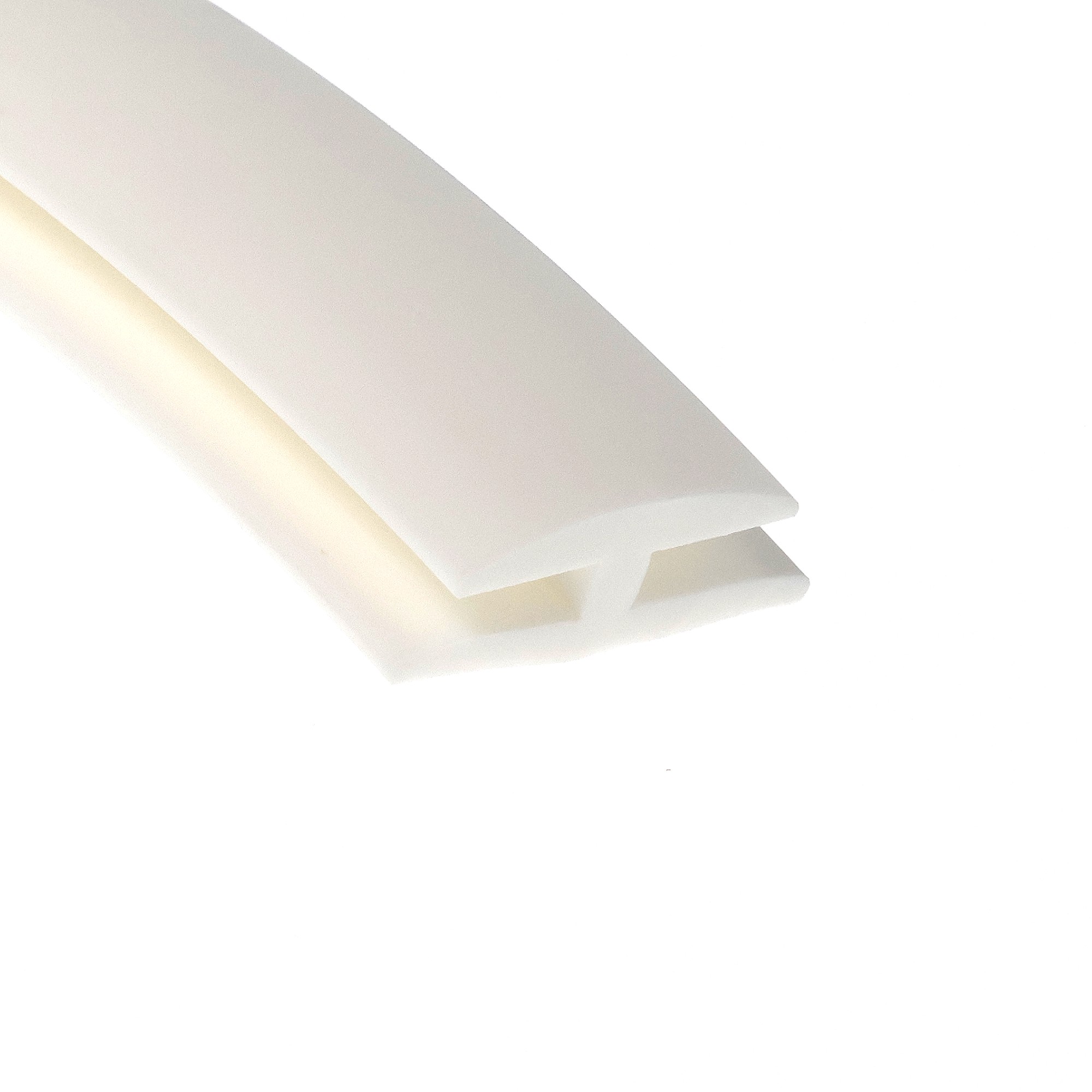 12-327_3144 - Centrum uszczelek Close-up of a white rolled sheet of paper diagonally across a white background, with soft shadows on the edges.