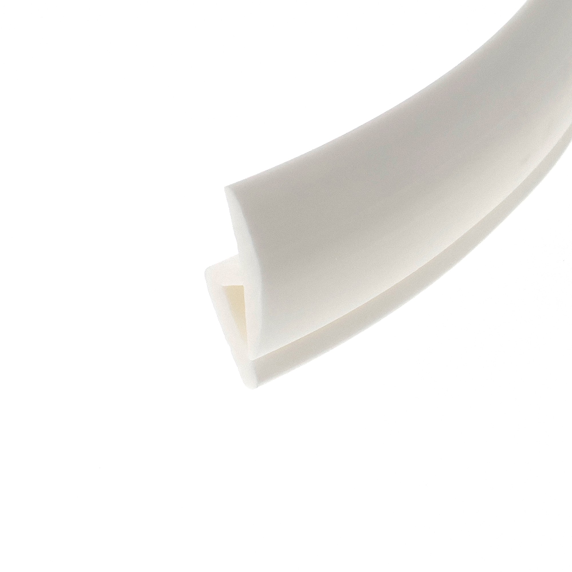 12-361_2164 - Centrum uszczelek Extreme close-up of a white curved object with soft gray edges against a white background.