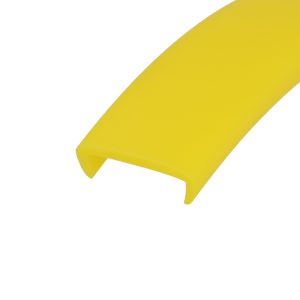 Close-up of a bright yellow curved plastic strip with a rounded edge against a white background.