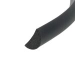 Close-up of a black, high-density foam roller cut end, showing hollow porous core against a white background.