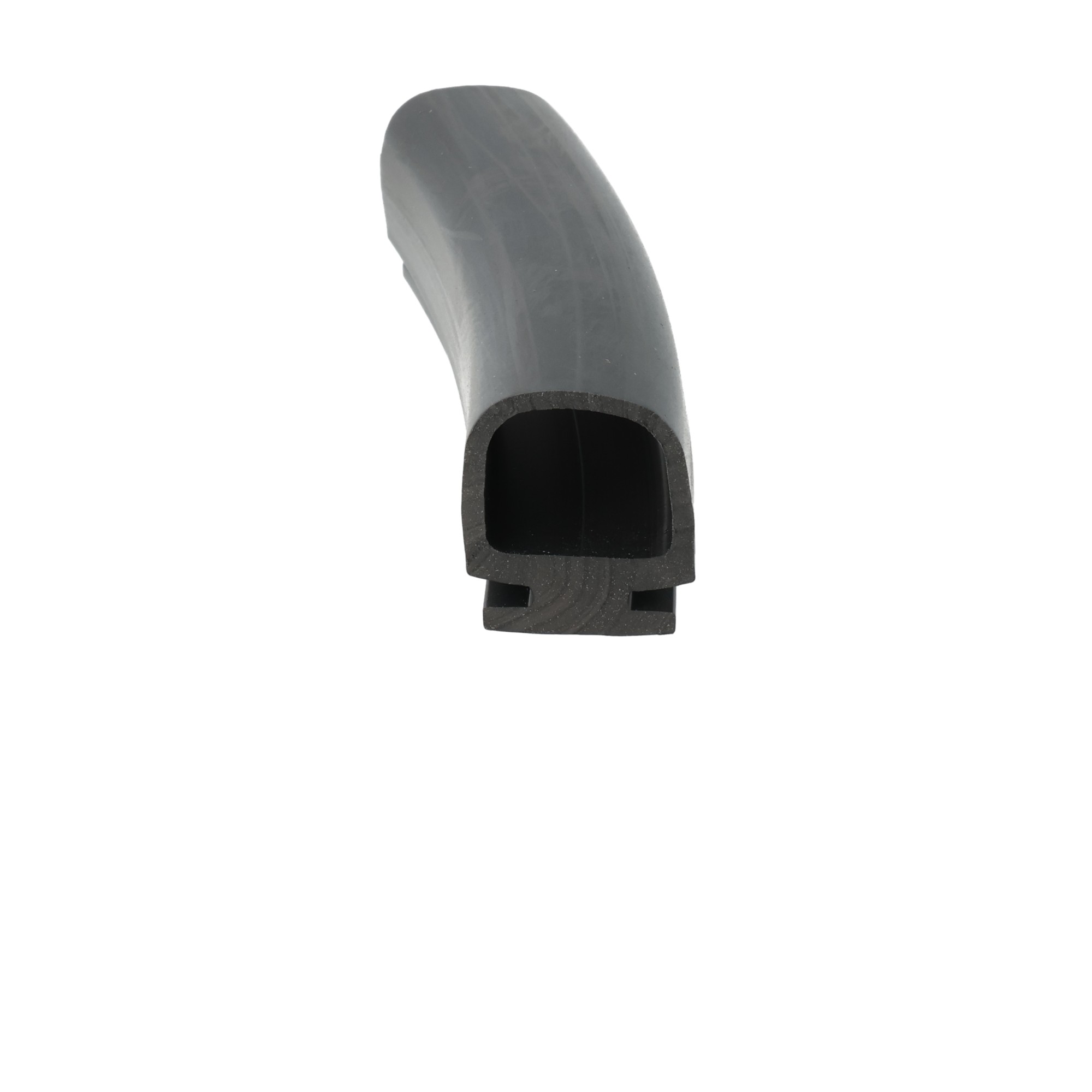 uszczelka-rolety-dolna-gumowa-20-x-26-x-24mm-czarna-0464076-1 - Centrum uszczelek Close-up of a gray curved PVC elbow pipe fitting with hollow interior, viewed from the side, on a white background.