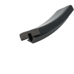 Close-up of a curved black machine blade with a square mounting hole for attachment