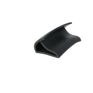 Close-up of a black curved plastic piece with a glossy finish, partially visible against a white background.