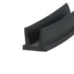 Close-up of a black foam rubber seal with a triangular cross-section and hollow foam interior edge.
