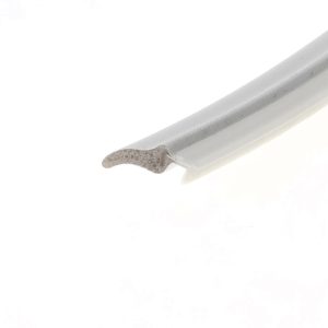 Close-up of a white foam-like piece and a white cylindrical object with a ribbed texture on a white background.