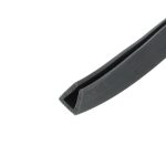 Close-up of a black rubber seal or channel with a groove, diagonally oriented along the lower-right corner.