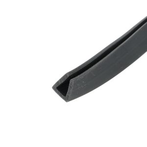 Close-up of a black rubber seal or channel with a groove, diagonally oriented along the lower-right corner.