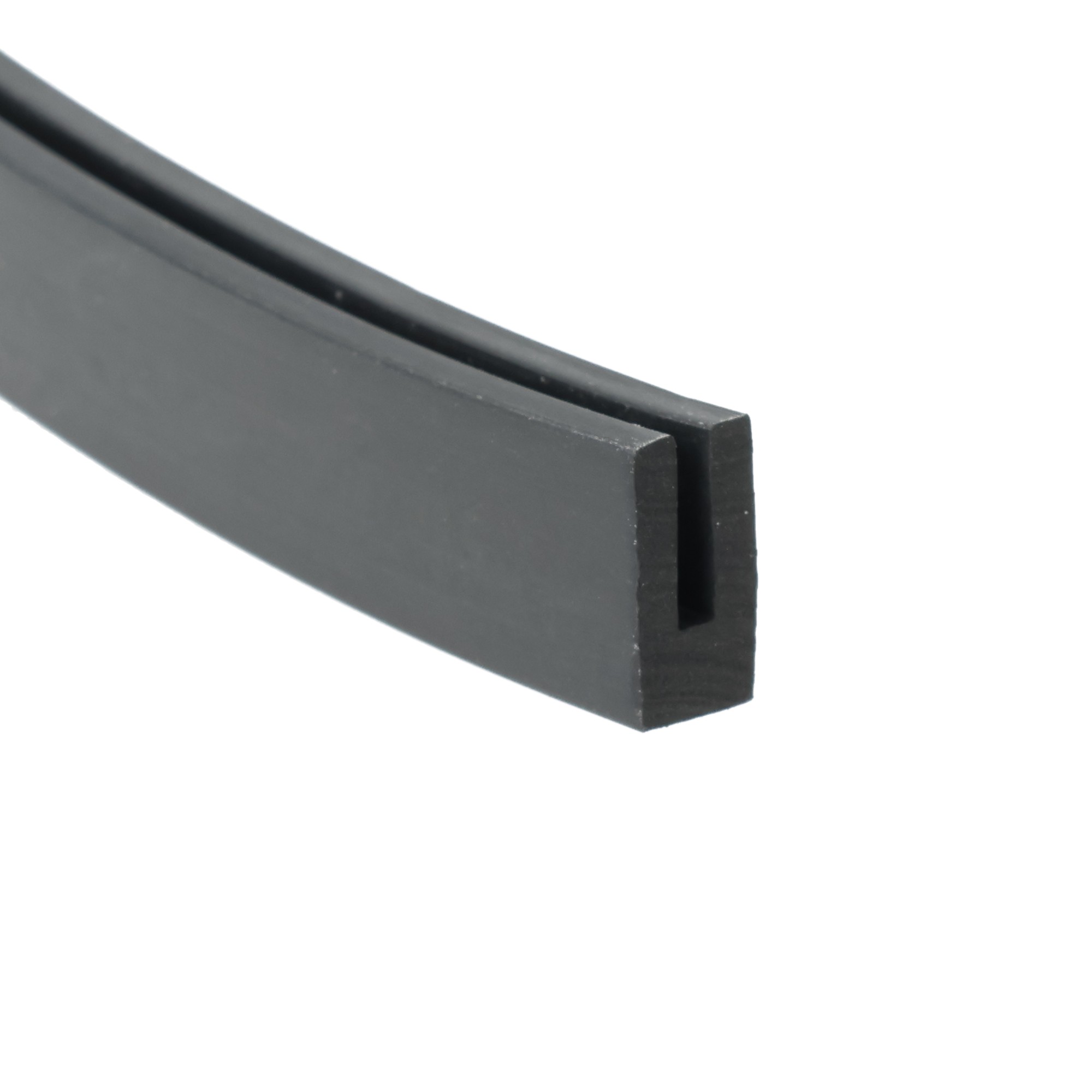 uszczelka-krawedziowa-typ-u-lita-guma-2-x-8-x-15mm-czarna-0351331-1 - Centrum uszczelek Close-up of a dark gray curved plastic piece with a rectangular right-angle block at the end, photographed against a white background