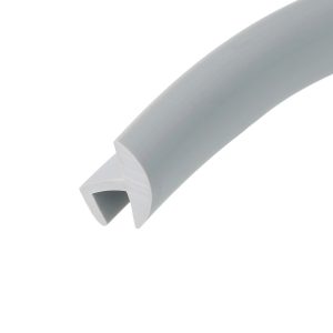 Close-up of a gray PVC pipe segment with a square-cut end and hollow interior, viewed diagonally across the frame.