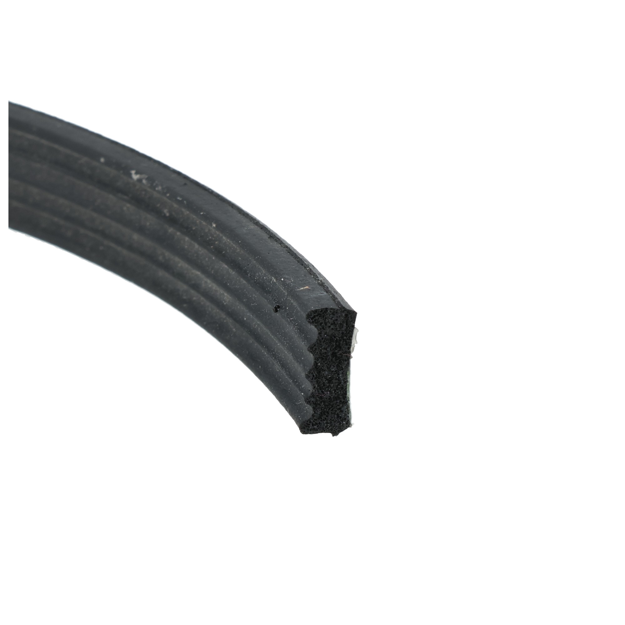 Uszczelka piankowa samporzylepna 4x9mm czarna - 04-505-2-1 - Centrum uszczelek Close-up of a black ribbed rubber tire edge diagonally across a white background, showing worn tread and a chipped section.
