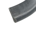 Close-up of a dusty dark gray sanding belt edge against a white background, showing rough grit.