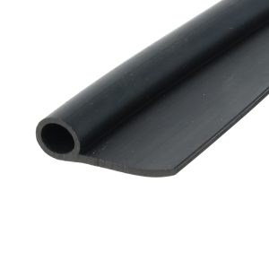 Close-up of a black hollow cylindrical tube with a circular opening, lying diagonally across a white background