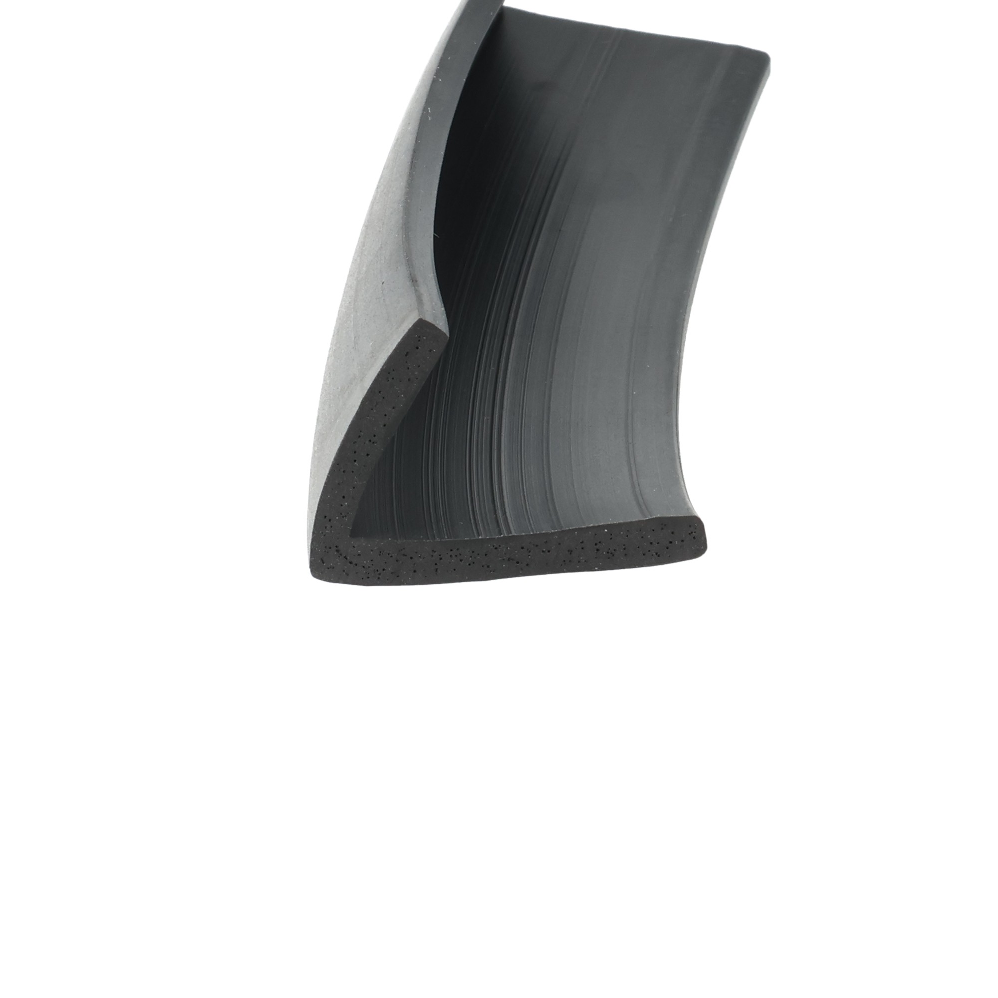 uszczelka-gumowa-typ-l-3-x-21-x-28mm-czarna-023620-3 - Centrum uszczelek Close-up of a dark, curved tool component with a speckled base on a white background