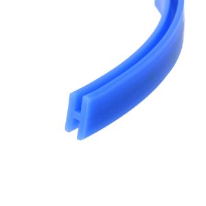 Close-up of a blue curved plastic piece with a hollow rectangular channel on a white background.