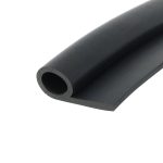 Close-up of a black rubber cylinder with a hollow center and smooth outer surface, showing the cut end at an angle.