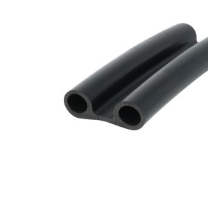 Three black hollow cylindrical tubes arranged diagonally, viewed from the side (close-up). We see smooth surfaces and circular openings.