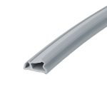 Close-up of a gray U-shaped metal/plastic channel extrusion running diagonally across the frame, showing its hollow interior.