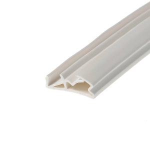 Close-up of a white plastic extrusion (trim/molding) shown diagonally across the frame, with internal channels visible at the cut end.