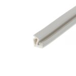 Close-up of a white plastic rectangular channel extrusion with hollow interiors, angled diagonally across the frame.