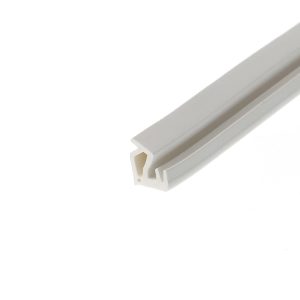 Close-up of a white plastic rectangular channel extrusion with hollow interiors, angled diagonally across the frame.