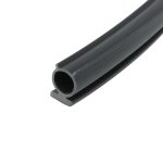 Close-up of a black rubber U-channel extrusion with a hollow circular cross-section and grooved edges