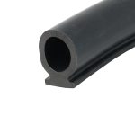 Close-up of a black cylindrical pipe end with a hollow center, photographed at an angle.