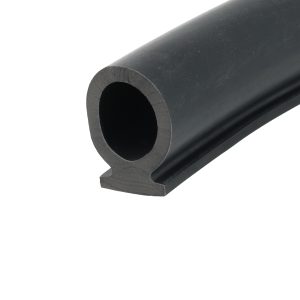 Close-up of a black cylindrical pipe end with a hollow center, photographed at an angle.