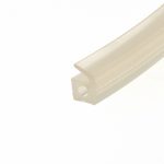 Close-up of beige-painted metal trim with rounded edge, oriented diagonally across the bottom-right corner.