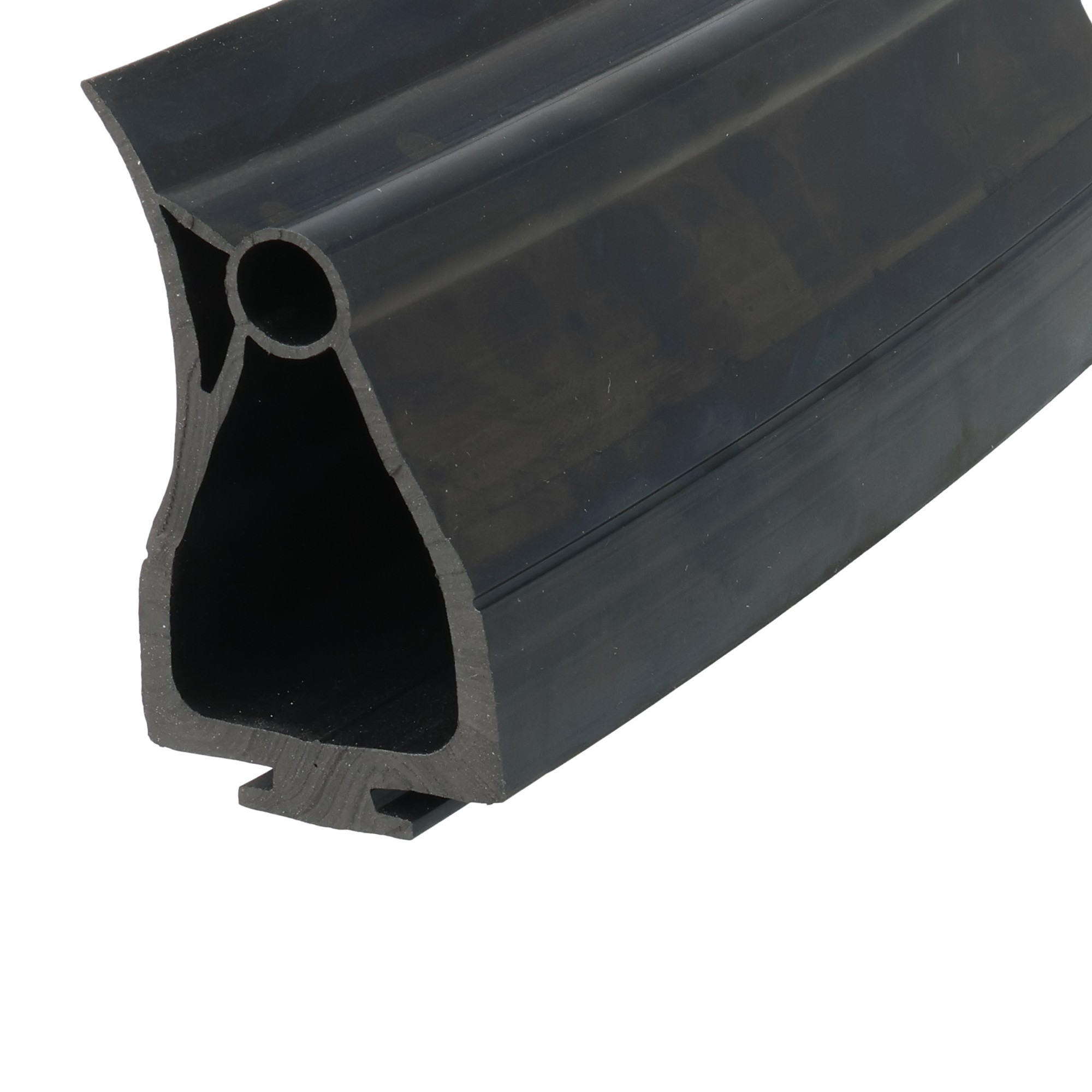 uszczelka-dolna-bramy-garazowej-gumowa-38-x-51mm-czarna-59-055-3 - Centrum uszczelek Close-up view of a black rubber seal with a rounded hollow channel visible along the profile.