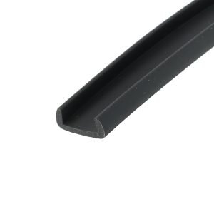 Close-up of a black rounded-edge tube or rail, diagonally across a white background.