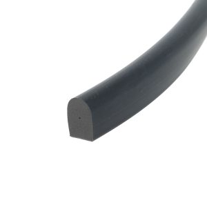 Close-up of a dark gray cylindrical tube or pipe running diagonally across the frame, with a rounded end visible at the bottom-left corner.