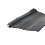 Close-up of a black rubber seal or gasket with a ribbed edge and hollow channel edge detail at the corner edge of a panel.