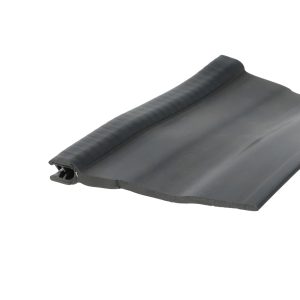 Close-up of a black rubber seal or gasket with a ribbed edge and hollow channel edge detail at the corner edge of a panel.