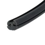 Close-up of black rubber weatherstrip with a U-shaped channel and groove (edge seal).