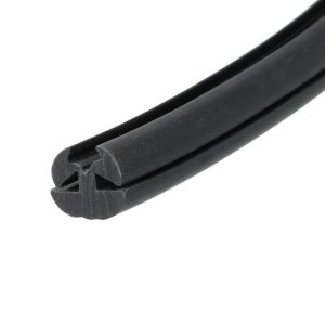Close-up of black rubber weatherstrip with a U-shaped channel and groove (edge seal).
