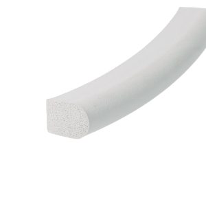 Close-up of a pale gray foam block with a porous cut end, resembling a piece of insulation foam from its cross-section.