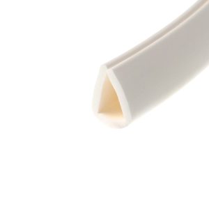 Close-up of a white curved object with a beige inner edge, diagonal across a white background.