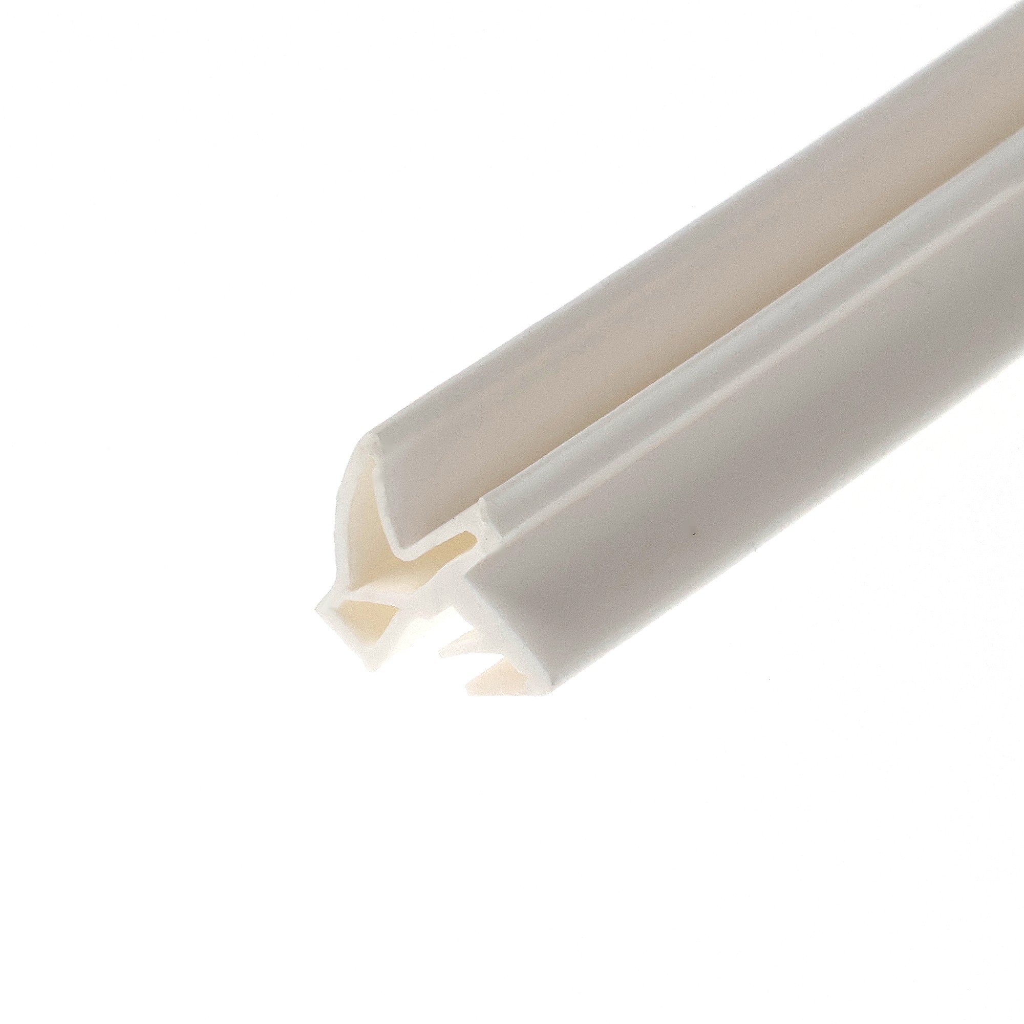 uszczelka-drzwi-wewnetrznych-drewnianych-s-6577-devneter-biala-070-098-1 - Centrum uszczelek Close-up of a white cylindrical object with a rounded end, showing beige inner lining and subtle shadows.