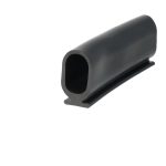 Close-up of a black tubular object with a hollow circular opening, angled against a white background.