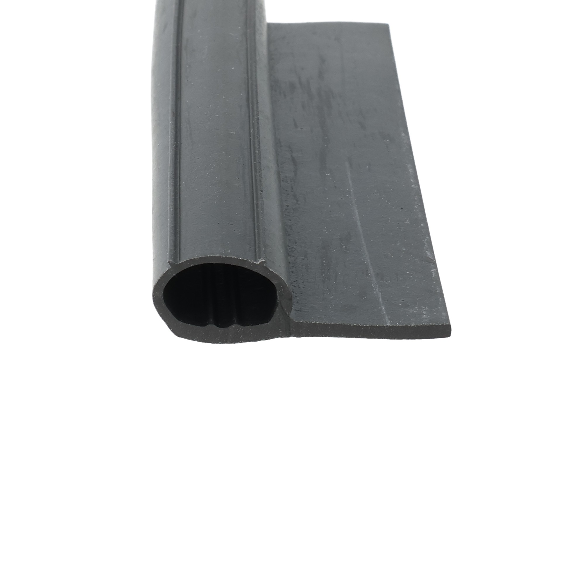 0357519_137 - Centrum uszczelek Close-up of a dark gray metal block with a cylindrical hollow tube extending from it, viewed from the side.