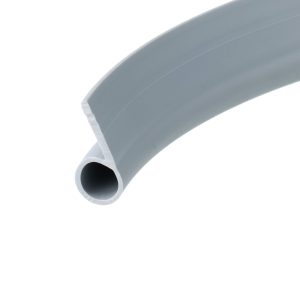 Close-up of a gray plastic cylindrical pipe with a hollow circular opening on the left, showing a seam along the curved surface.