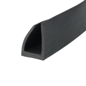 Close-up of a dark, matte metal edge with rounded corner and scratched surface on a diagonal plane