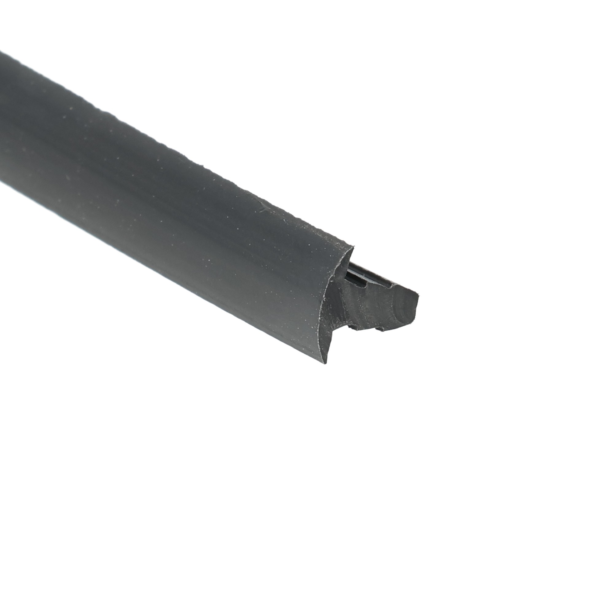 uszczelka-do-szczeliny-plastyfikowane-pvc-typu-t-8-x-9mm-czarna-18-68801-2 - Centrum uszczelek Close-up of a torn black adhesive tape strip laid diagonally on a white background.
